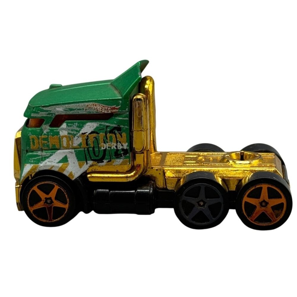 Hot Wheels Green & Gold Die-Cast Demolition Derby Truck With Black & Orange Whee